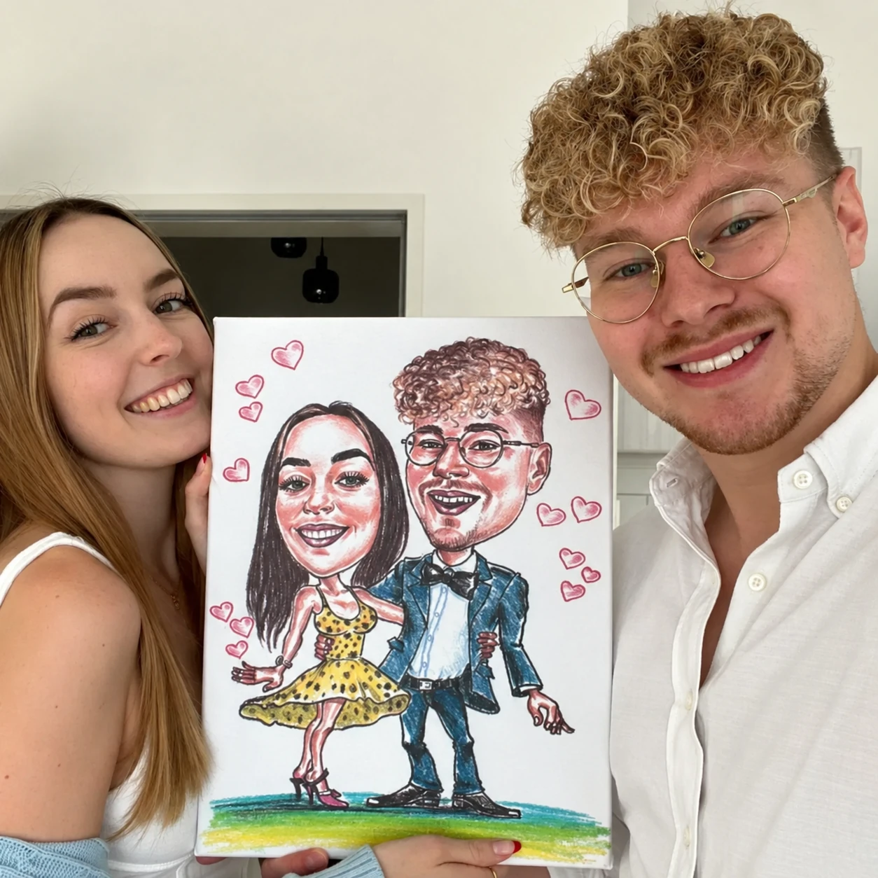 A couple holding their personalised Picassify caricature